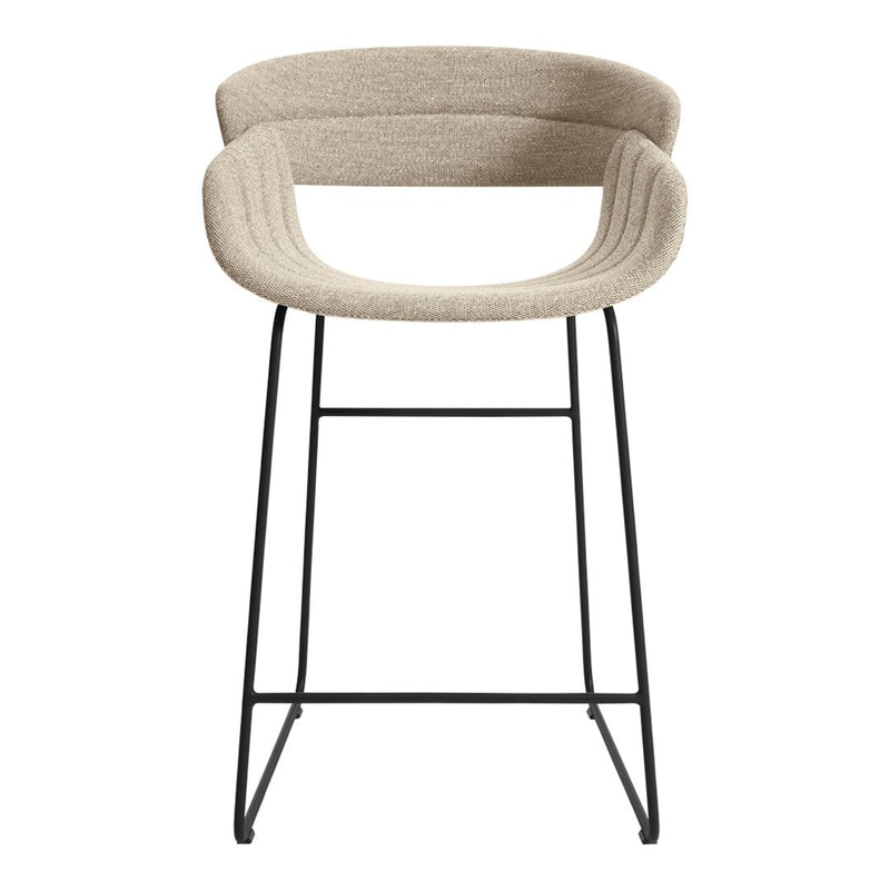 Beige upholstered barstool with ribbed pattern and black metal frame, minimalist design for modern spaces.