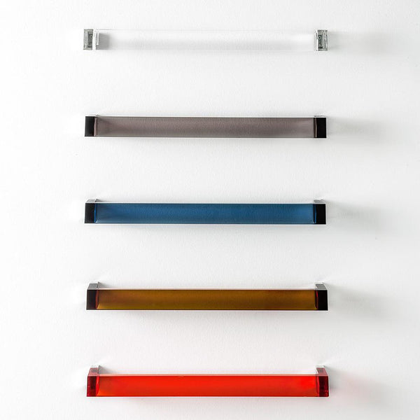 Colorful glass shelf set featuring clear, gray, blue, amber, and red panels with sleek black brackets.
