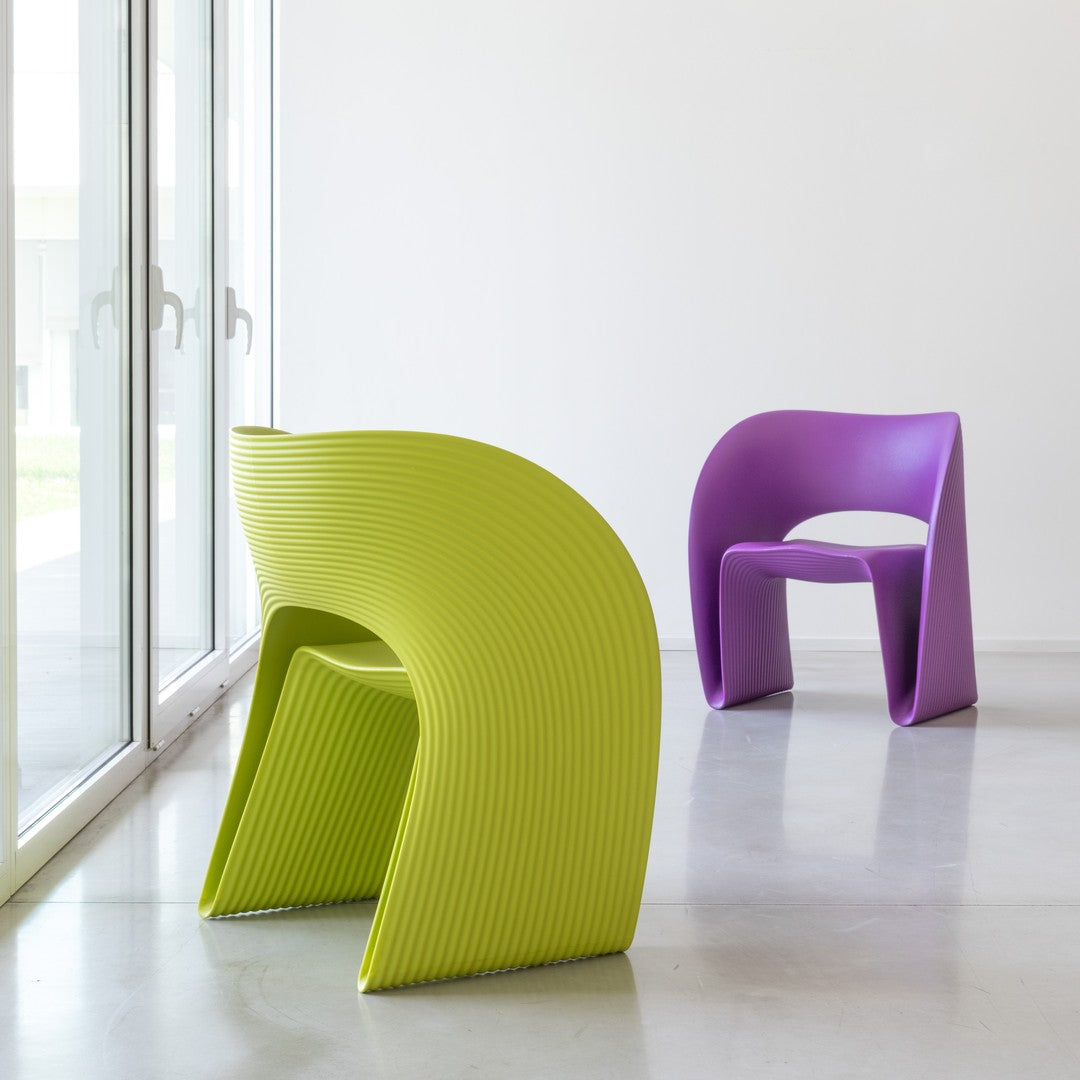 Green and purple modern chairs with ribbed patterns, perfect for vibrant decor and contemporary spaces.