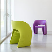Green and purple modern chairs with ribbed patterns, perfect for vibrant decor and contemporary spaces.
