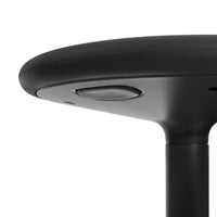 Black round table top with a smooth finish and subtle textures. Sleek, modern design in matte black.