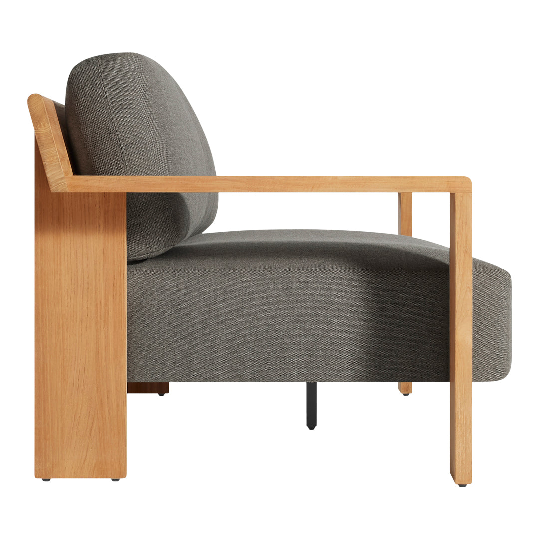 Gray upholstered chair with a natural wood frame and minimalist design. Soft textures and contemporary lines.