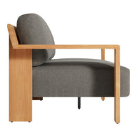 Gray upholstered chair with a natural wood frame and minimalist design. Soft textures and contemporary lines.