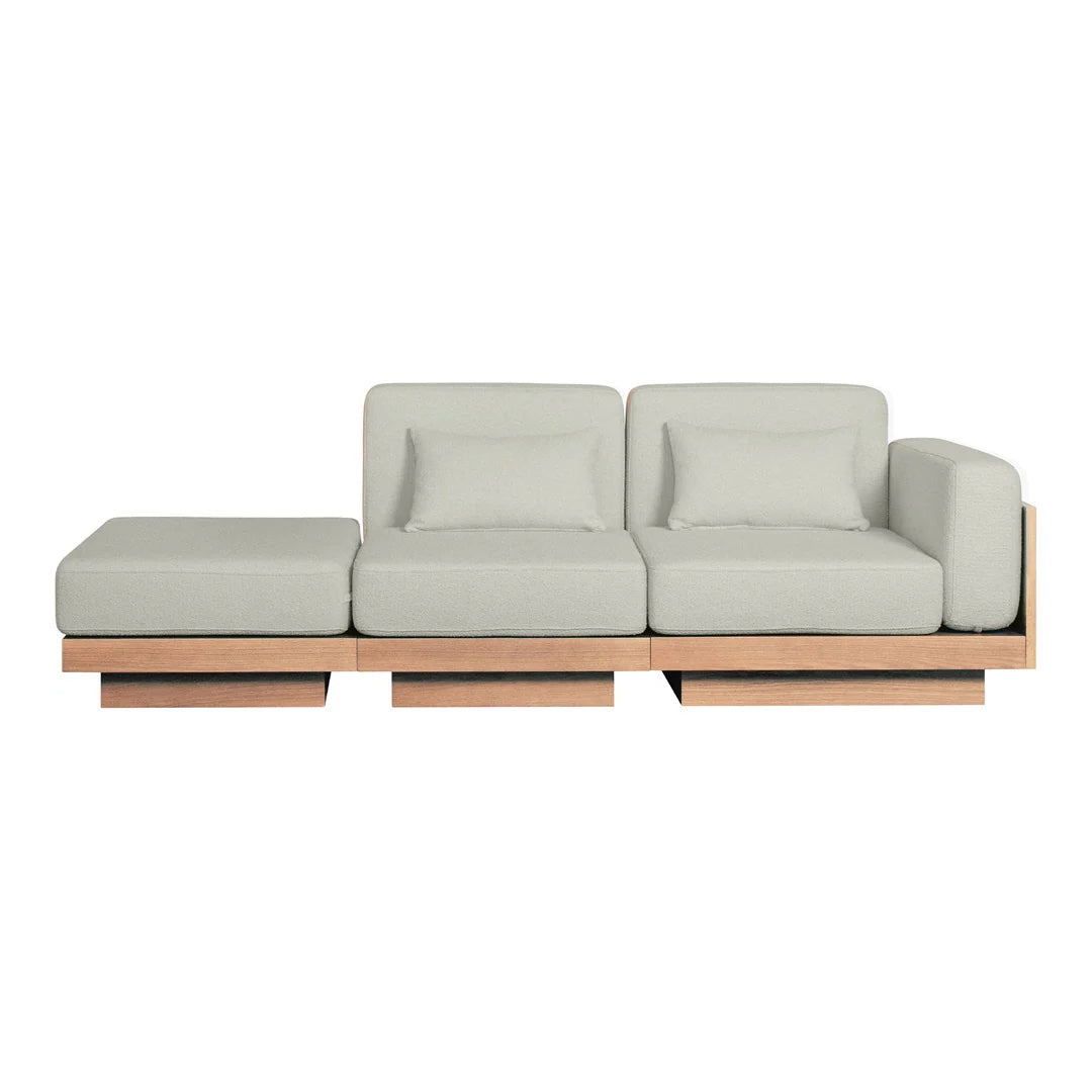 Light gray modern sofa with clean lines and a smooth fabric finish, featuring a minimalist wooden base.