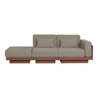 Modern sectional sofa in soft gray upholstery with a sleek wooden base, featuring minimalist design and clean lines.