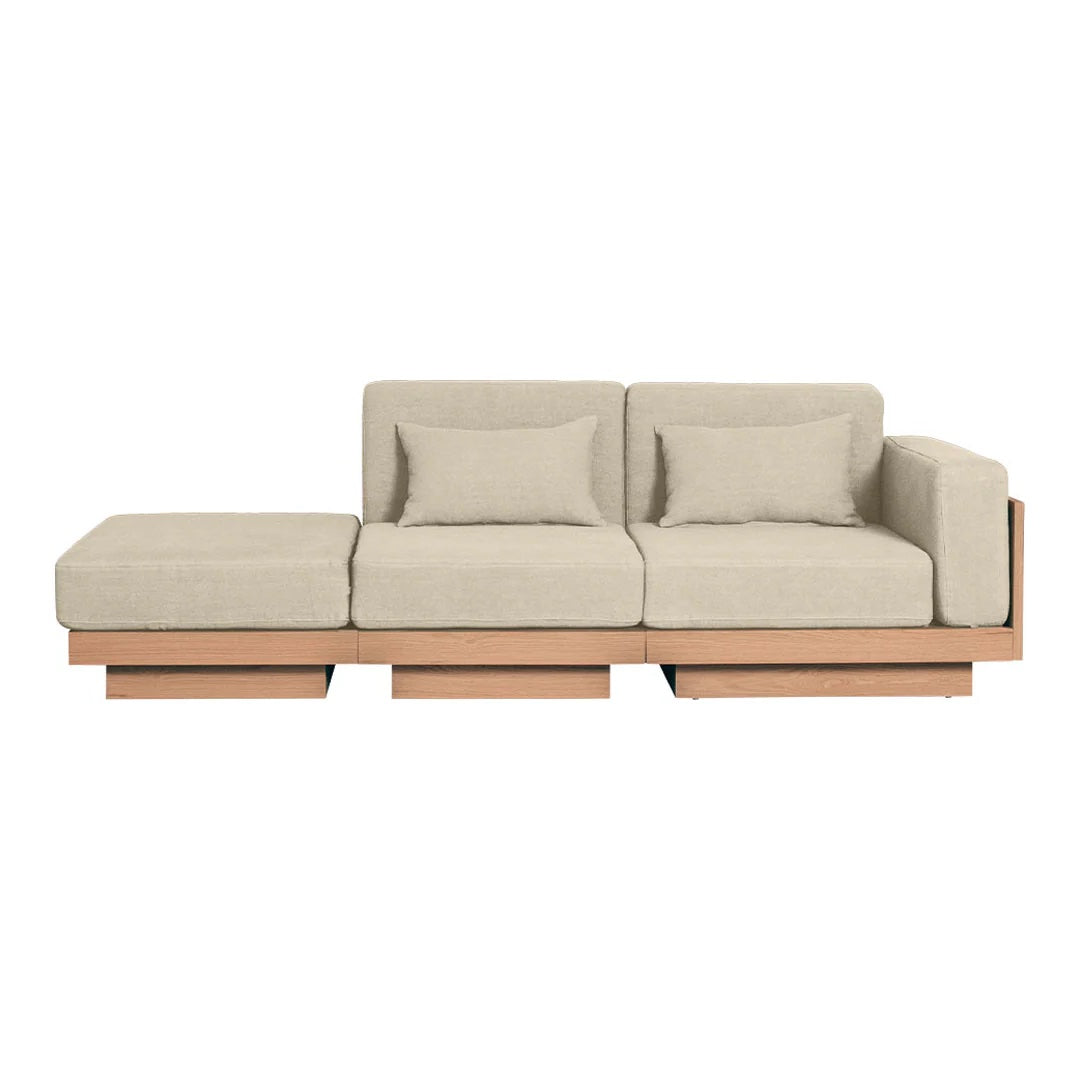 Beige sectional sofa with clean lines and soft fabric, featuring a minimalist wood base. Perfect for modern decor.
