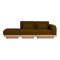 Modern brown velvet sofa with a sleek wooden base, featuring a solid color and minimalist design. Perfect for stylish interiors.