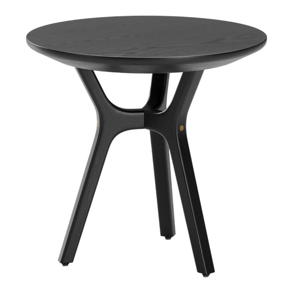Black round table with a smooth surface and sleek, modern design, featuring contrasting wooden accents on legs.
