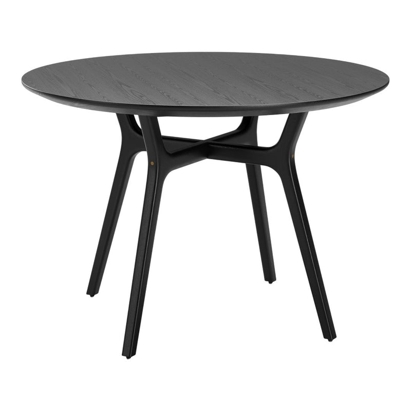 Black round dining table with a smooth finish and minimalist design, featuring elegant, sleek black legs.