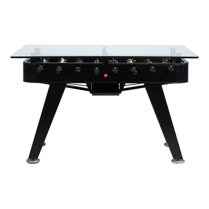 Black foosball table with sleek glass top and silver accents, featuring a modern design and minimalist aesthetics.