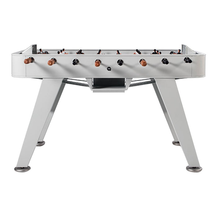 Silver foosball table with sleek gray legs, featuring dark wooden handles and black player figures.