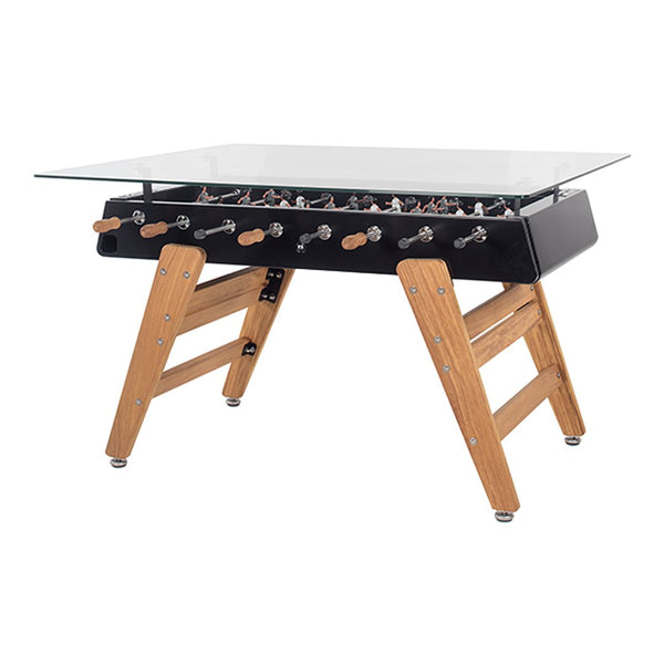 Black foosball table with wooden legs and clear glass top. Modern design with contrasting materials and colors.