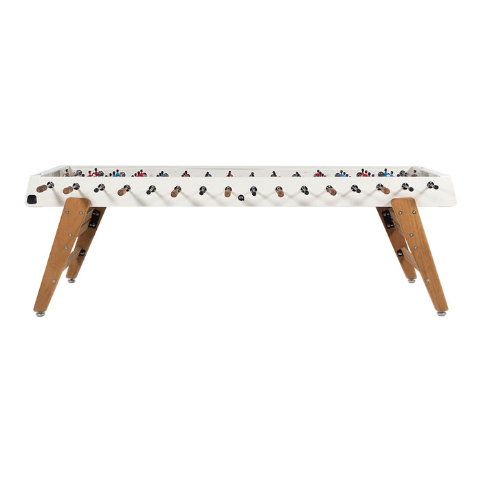 White foosball table with wooden legs, featuring red, blue, and black player figures on a sleek, contemporary design.