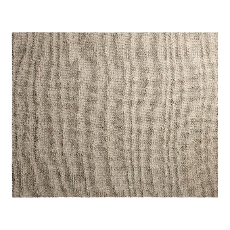 Soft beige area rug with a subtle textured pattern, perfect for adding warmth to any room.