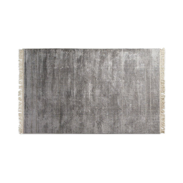 Gray rug with subtle textured pattern and fringed edges, adding a modern touch to any space.
