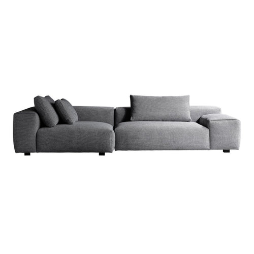Modern grey sectional sofa with soft, textured fabric and plush cushions, ideal for contemporary living spaces.
