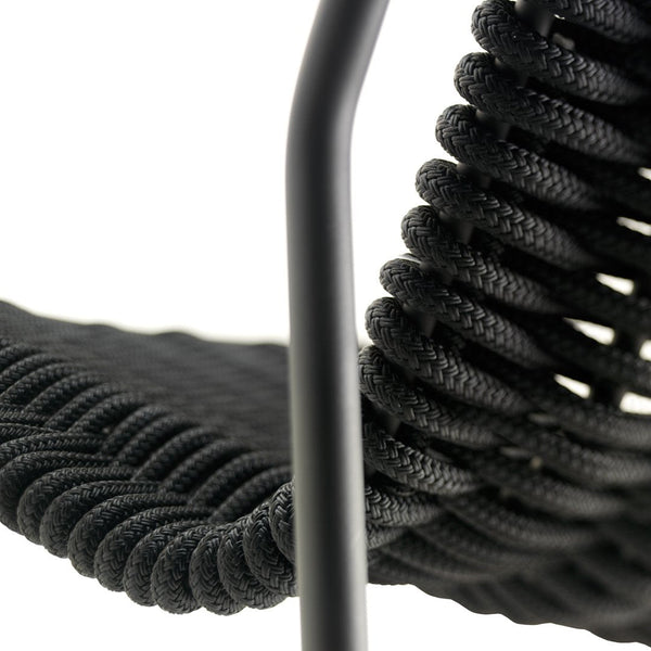 Black textured rope chair with a sleek metal frame, featuring a spiral design for a modern look.