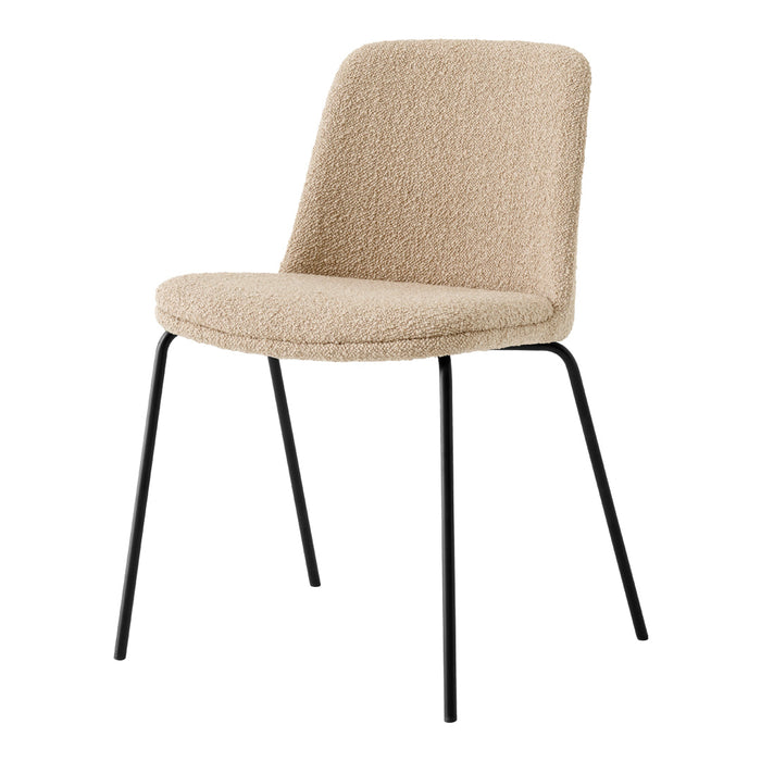 Beige textured fabric chair with sleek black metal legs, perfect for modern decor and versatile styling.