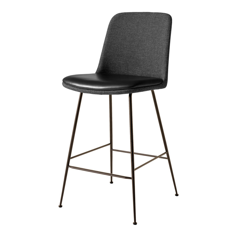 Black upholstered stool with a sleek design and a minimalistic brown metal frame. Perfect for modern spaces.