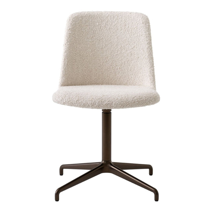 Cream textured chair with a smooth surface and a dark metal base. Modern design perfect for any workspace.
