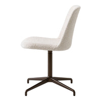 Neutral cream upholstered chair with a soft texture and a sleek dark metal base. Ideal for modern decor.