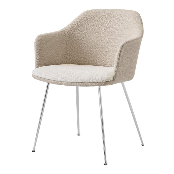 Beige upholstered chair with a smooth texture and chrome legs, perfect for modern decor.
