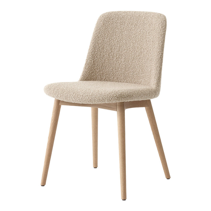 Light beige upholstered chair with soft, textured fabric and natural wooden legs. Modern and minimalist design.