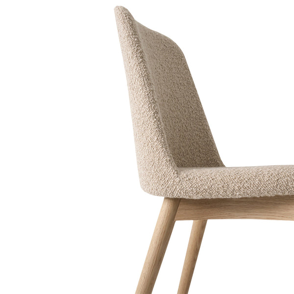 Beige textured chair with a soft, fluffy finish and natural wood legs, showcasing a minimalistic design.