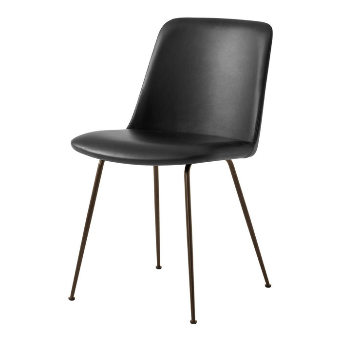 Black modern chair with sleek leather upholstery and slender metal legs. Minimalist design enhances any decor style.