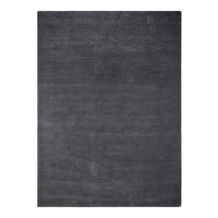 Solid charcoal gray area rug with a smooth, textured surface, perfect for modern decor.