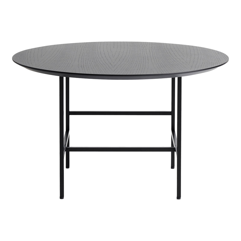 Round black table with a textured surface and sleek metal legs, perfect for modern decor.