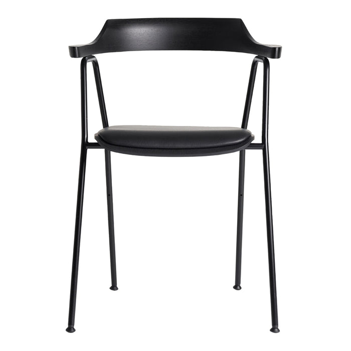 Black dining chair with a sleek, minimalist design and smooth curved patterns, perfect for modern interiors.