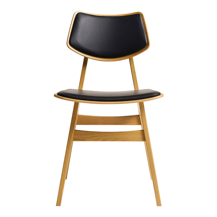 Black and natural wood dining chair with a sleek, modern design and curved backrest. Perfect for stylish interiors.