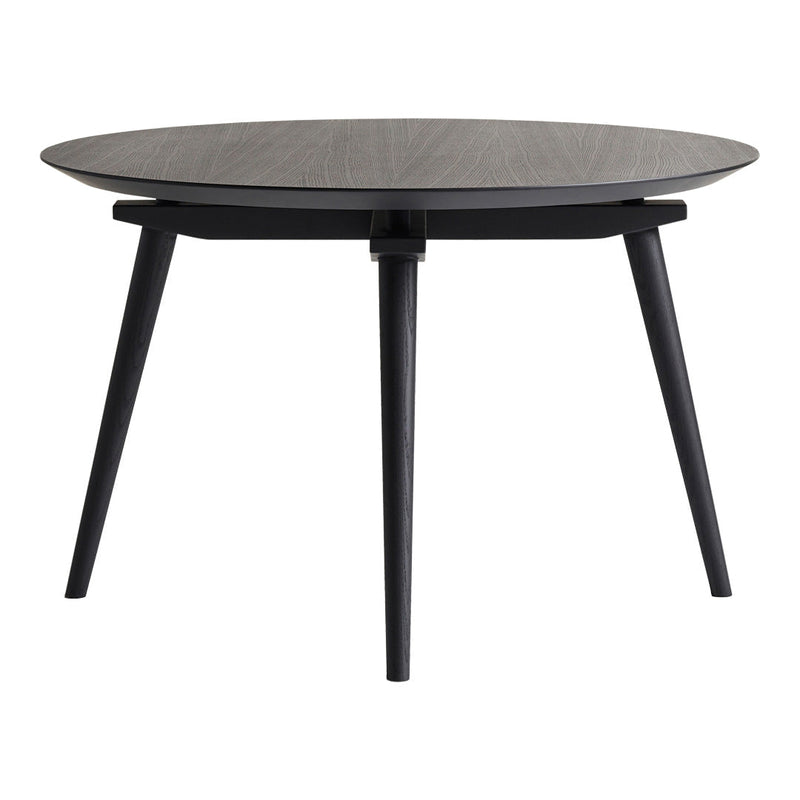Round black coffee table with a textured dark wood top and sleek black legs, perfect for modern decor.