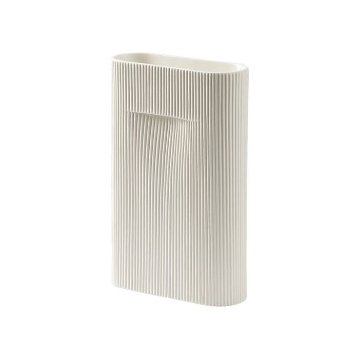 Elegant white vase with vertical ribbed texture, perfect for modern decor.