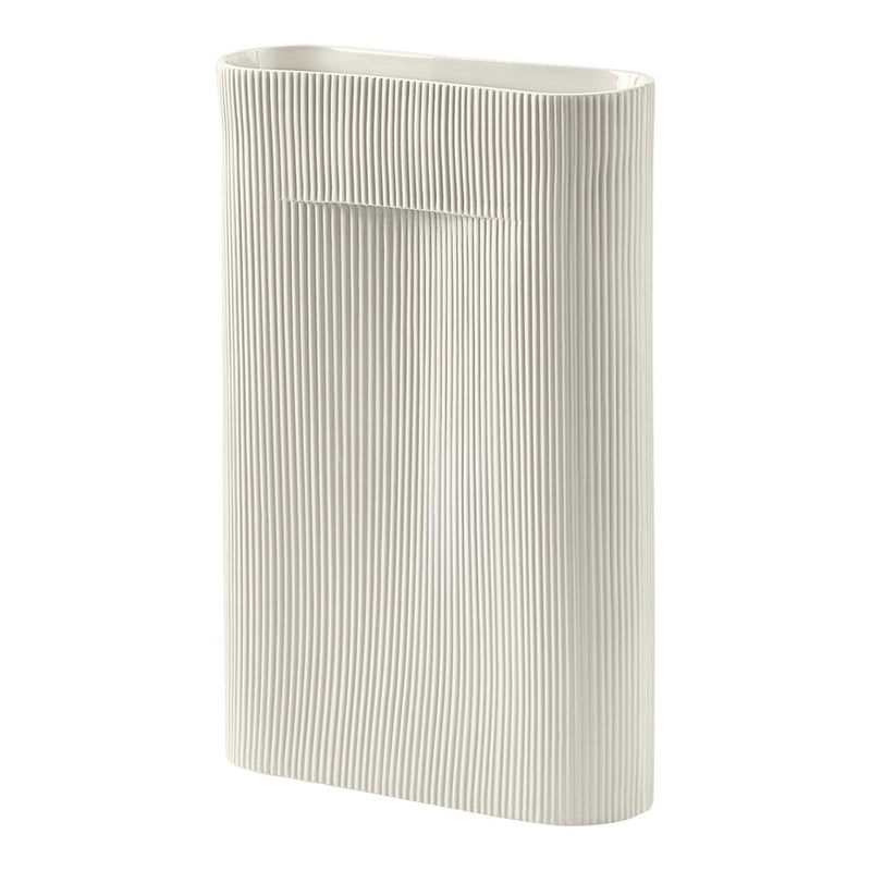 White ceramic vase with vertical ridges, featuring a minimalist design and subtle texture. Perfect for modern decor.