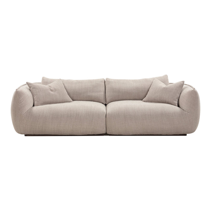 Beige sofa with a textured pattern and plush cushions, creating a cozy and inviting look for any space.