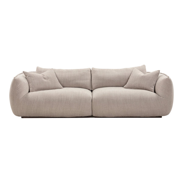 Beige, textured fabric sofa with soft, rounded edges and matching throw pillows. Perfect for modern living spaces.