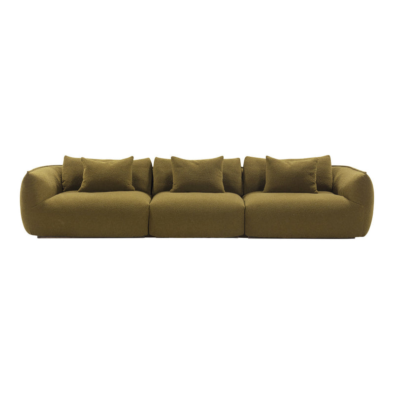 Plush olive green sofa with soft, rounded shapes and multiple coordinating pillows for a cozy, modern look.