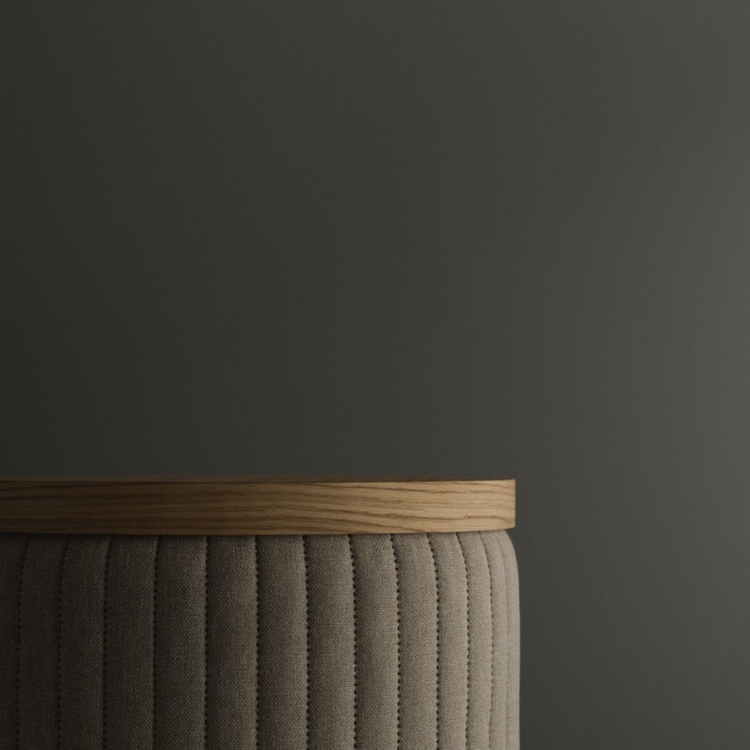 Beige ribbed fabric with a natural wood top against a dark gray background. Modern, stylish design element.