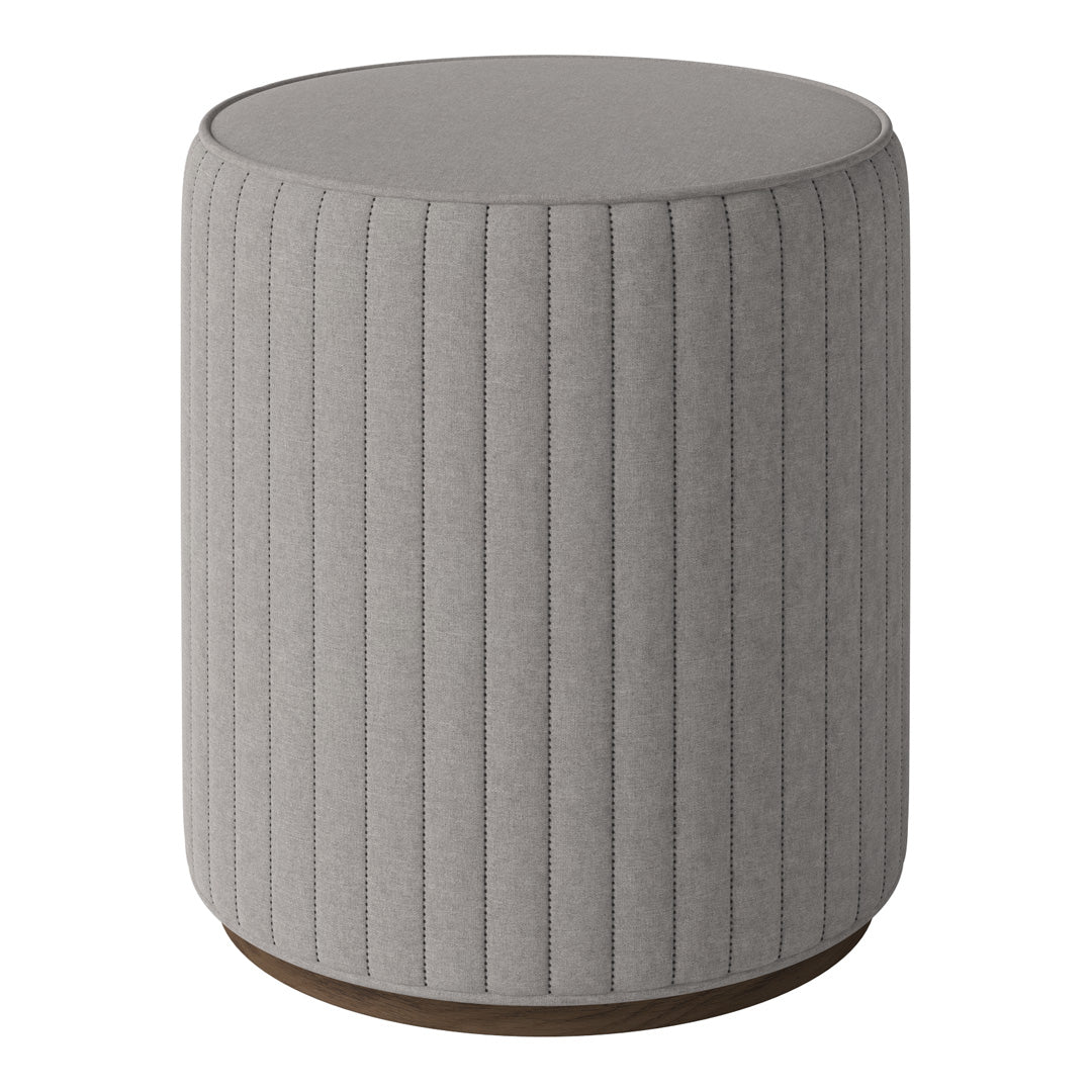 Gray upholstered round stool with vertical ribbed pattern and a wooden base. Perfect for modern decor.