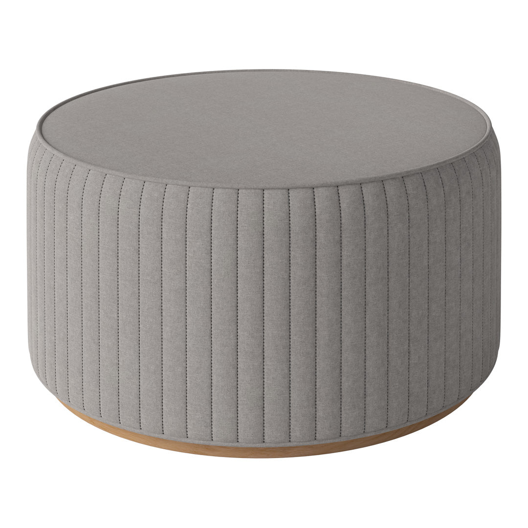 Gray ribbed round ottoman with a wooden base, featuring a soft texture and contemporary design.