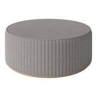 Gray ribbed round ottoman with a smooth top and light wooden base, perfect for modern decor.