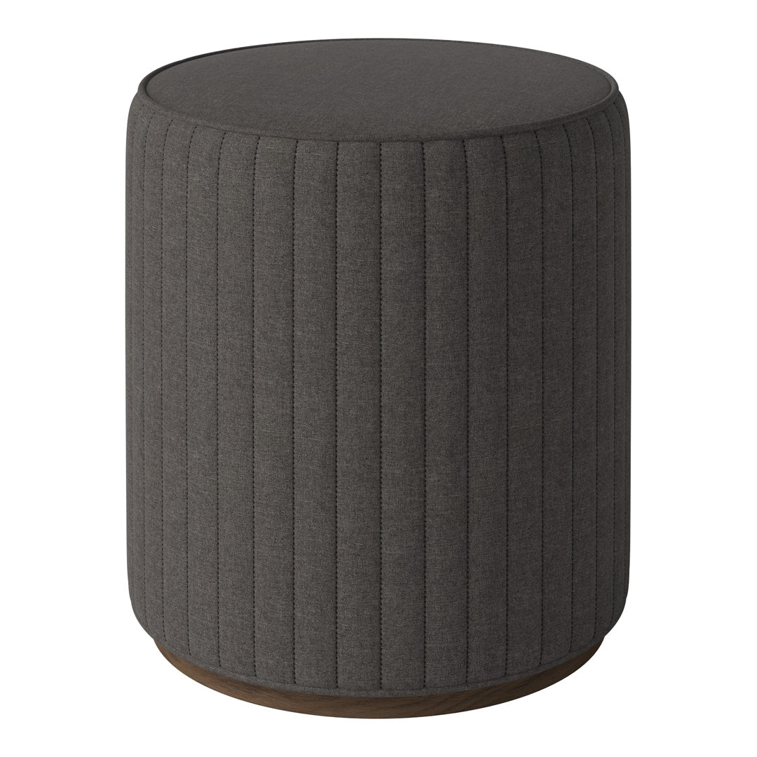 Gray ribbed upholstered ottoman with a rounded top and wooden base. Modern and stylish accent for any decor.