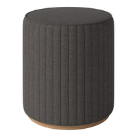 Dark gray upholstered round stool with vertical ribbed texture and a natural wood base. Ideal for modern decor.