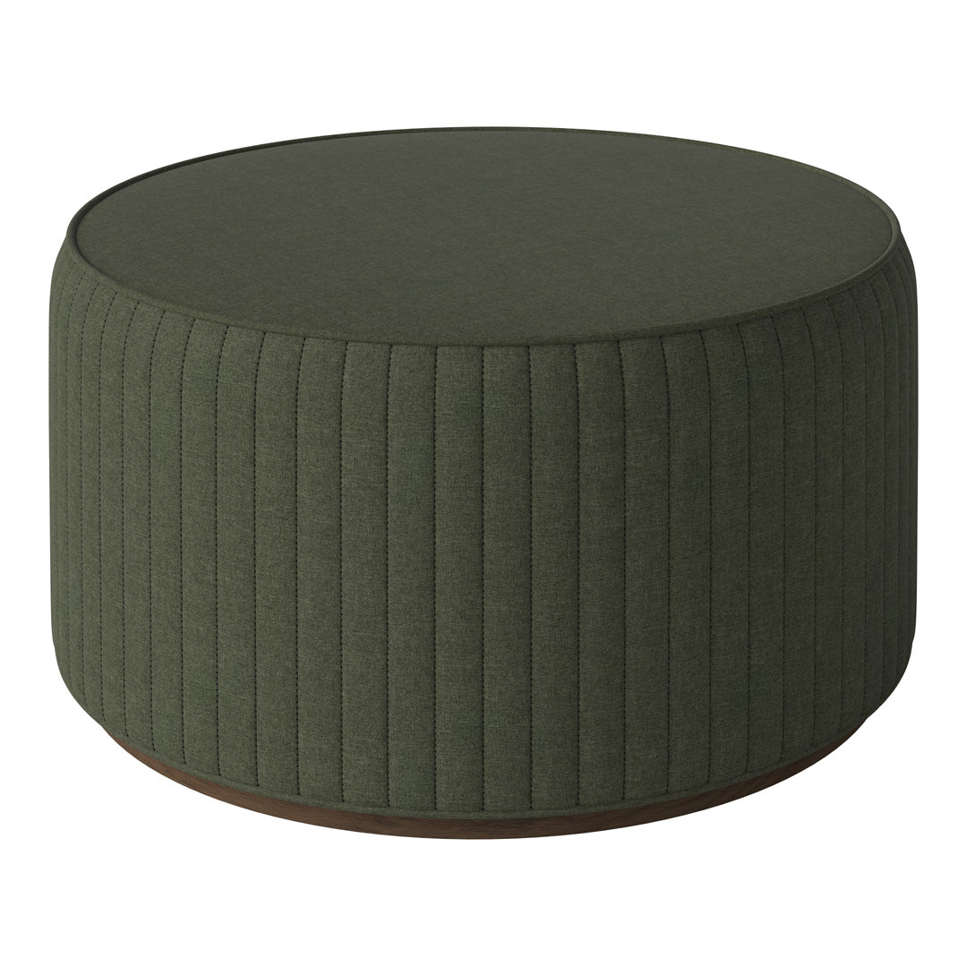 Green upholstered round ottoman with vertical ribbed texture and a wooden base. Ideal for modern decor.