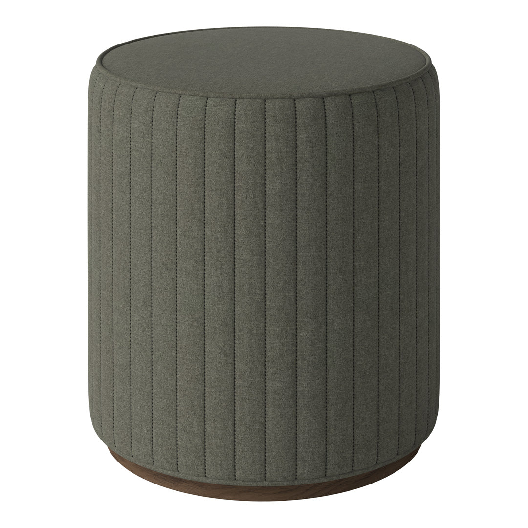 Round ottoman in muted olive green with vertical ribbed pattern and dark wooden base. Ideal for modern decor.
