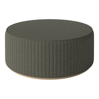Round green ottoman with vertical ribbed pattern and a smooth wooden base. Perfect for modern decor.