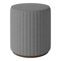 Gray upholstered stool with vertical ribbed pattern and a wood base, adding modern texture to any space.