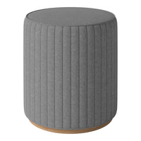 Gray fabric round stool with vertical ribbed pattern and a smooth wooden base. Perfect for modern decor.
